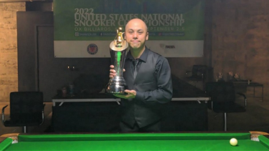 The 2022 United States National Snooker Champion, Steven Wong, pictured holding The Tom Kollins Trophy