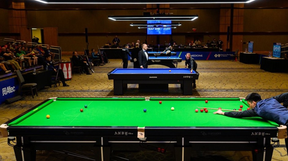 Thailand's Taweesap Kongkitchertchoo pictured at the table during his round of 16 match, with a view of the playing arena